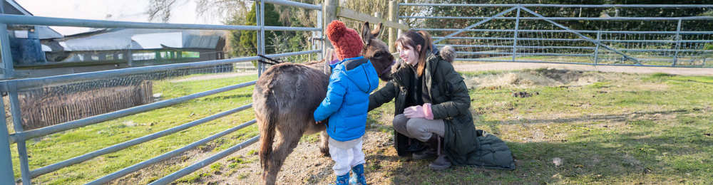 Kid and mum at petting farm
