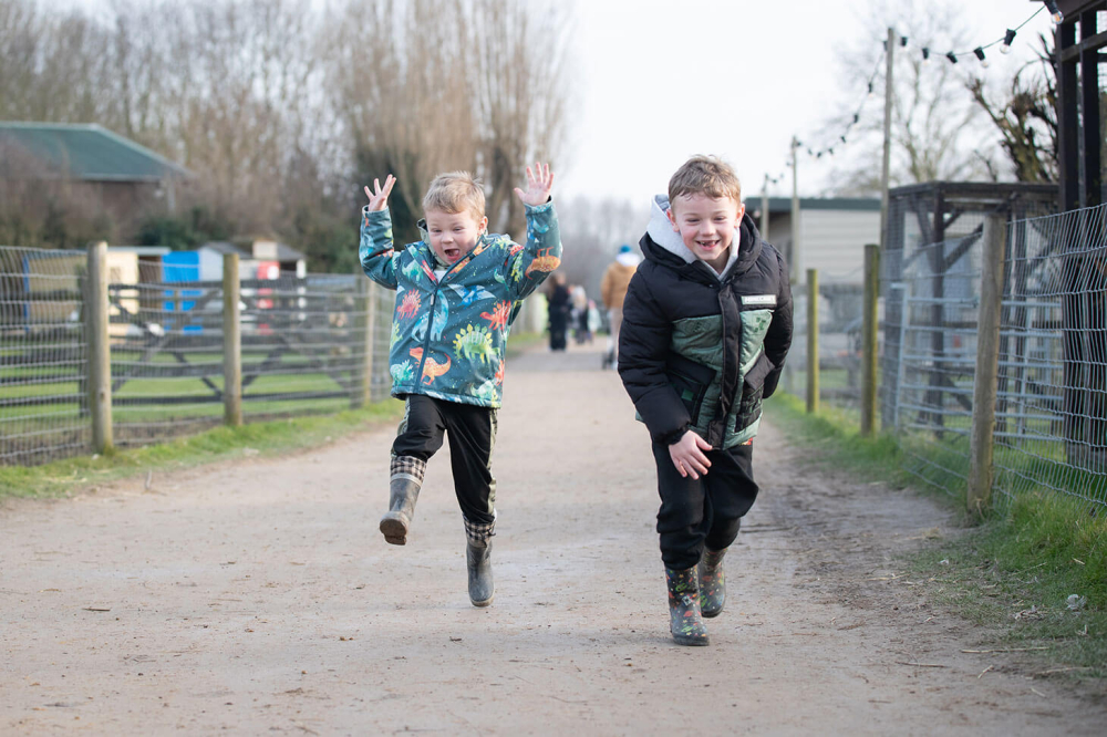 Boys running down a lane